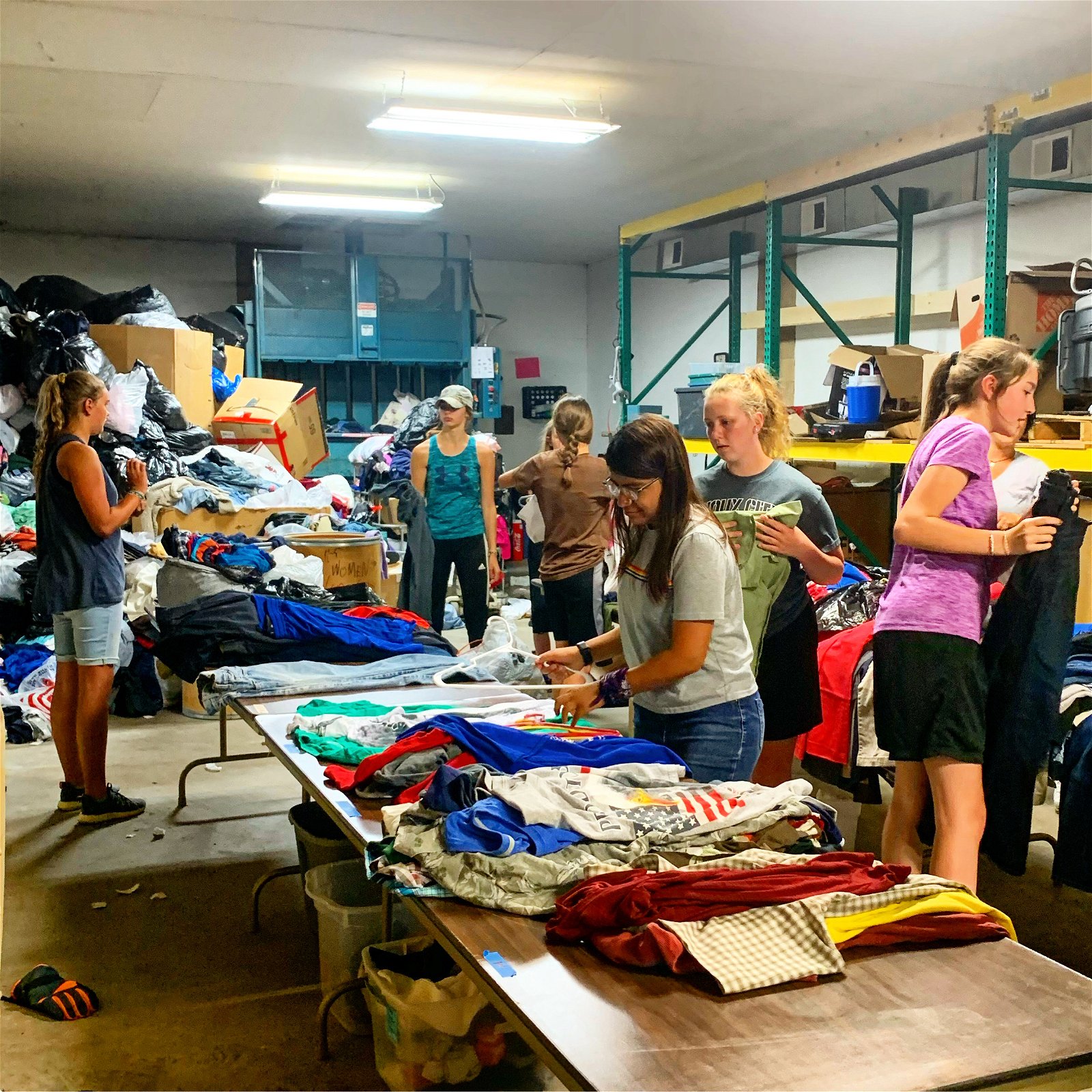 Volunteers organizing clothes